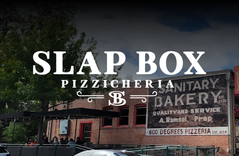 Slapbox logo with a background of the restaurant building.