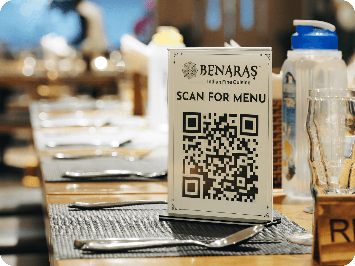 A “Scan for menu” QR code table tent on a restaurant table